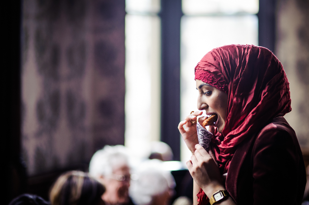girl eating fish and chip canape