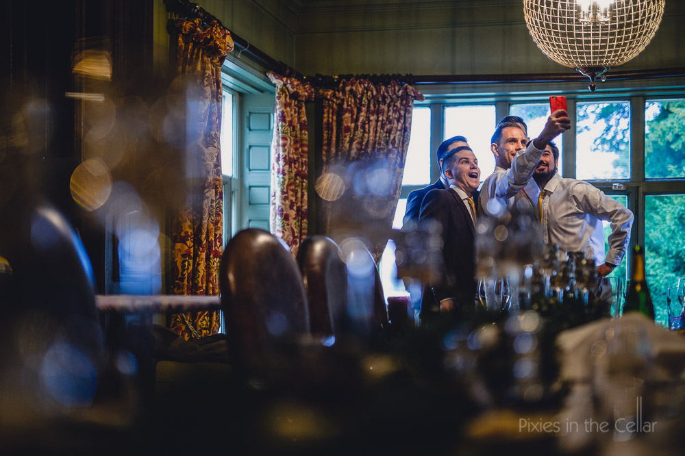 groomsmen selfie mitton hall winter wedding