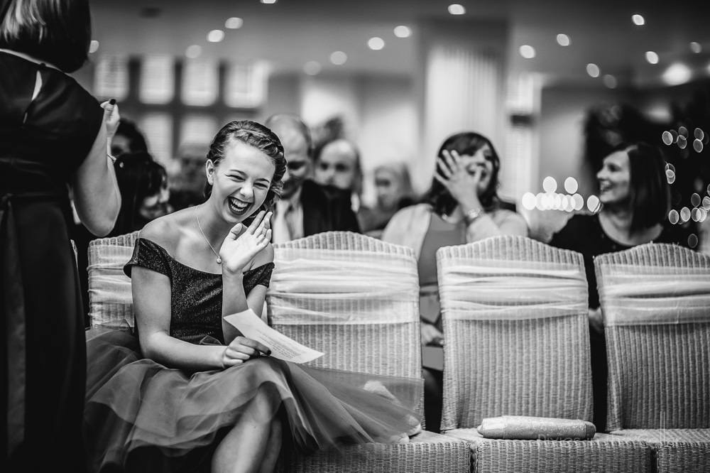 laughing wedding guest