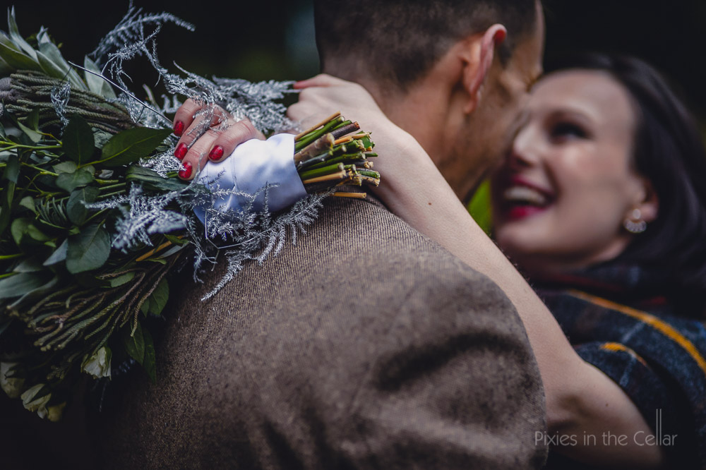 winter wedding bouquet and red nails