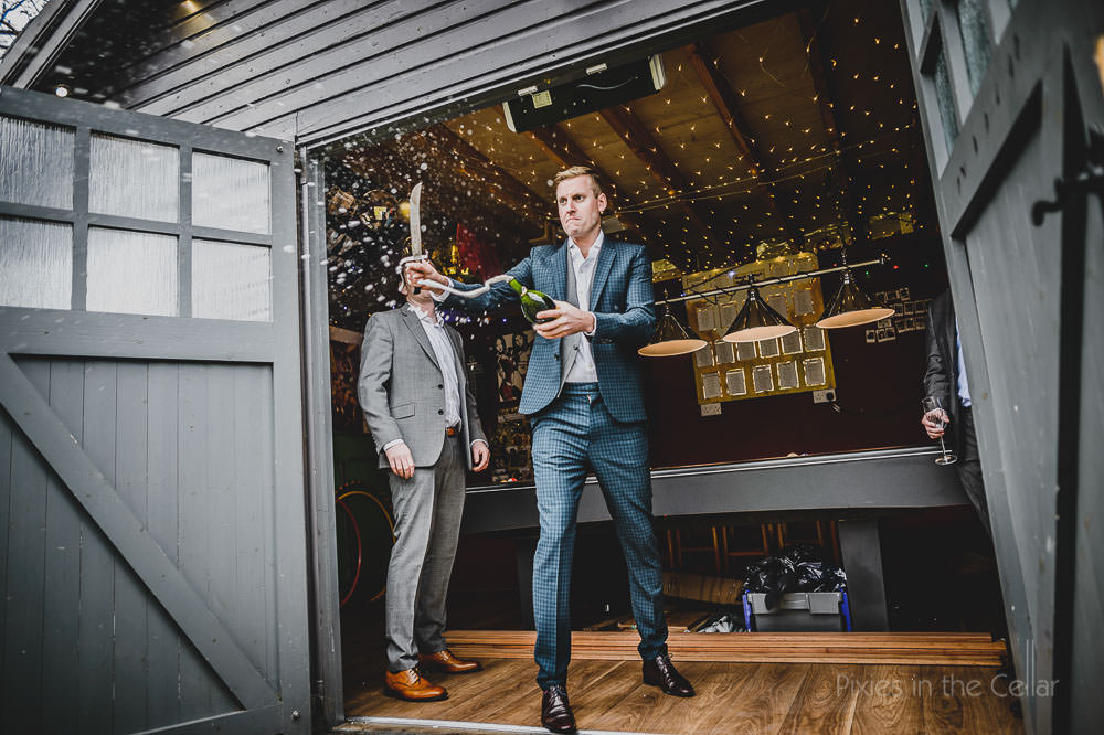 opening champagne with knife