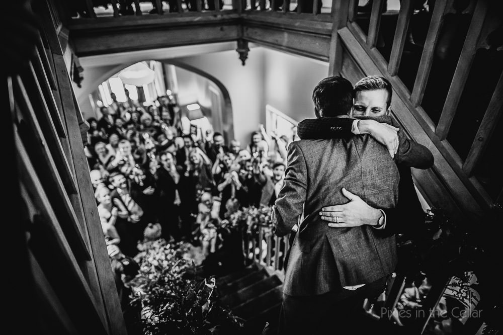 groom best man hug after wedding speeches