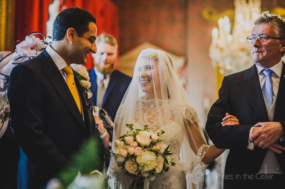 groom bride in veil and dad