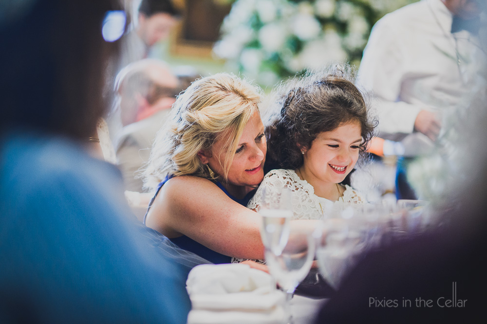 wedding guest and flower girl at table