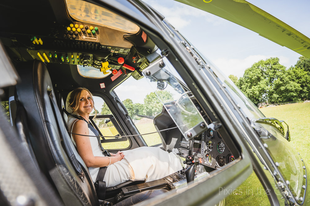bride travelling by helicopter Cheshire outdoor wedding
